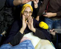 Aminatu Haidar, sonrie a punto de coger el avin rumbo a El Aain 