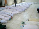Los cuerpos de las vctimas de la matanza de Hula en el depsito de un hospital de la ciudad siria 